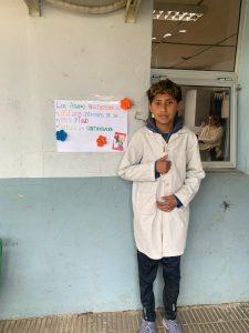 Children from School No. 64 in Salto showing posters on environmental care.